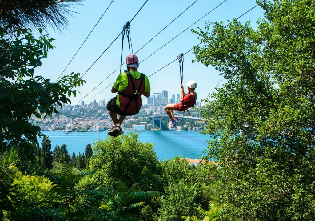pexels photo 16259505 16259505 Thrilling ziplining experience overlooking a bustling cityscape, surrounded by lush vegetation.